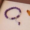 charoite bracelet, four-leaf clover charm