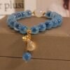 Blue Agate Bracelet with Luck Pouch Charm - Wealth & Good Fortune