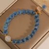 Blue Agate Bracelet with Luck Pouch Charm - Wealth & Good Fortune