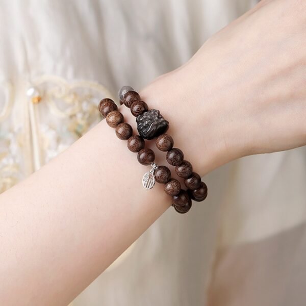 lion dance 1 Sandalwood Silver Obsidian Awakening Lion Bracelet for Protection & Courage